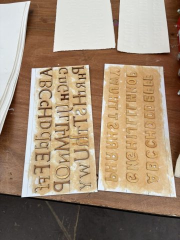 Marian Haf’s wooden lettering cut by laser cutter. Marian Haf print workshop for children at 2026 Eisteddfod