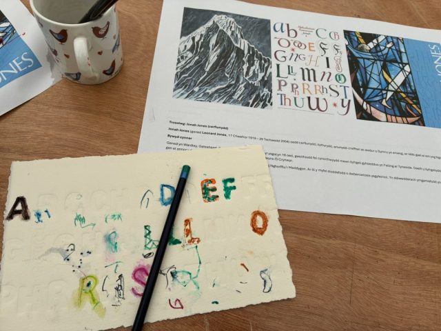 Jonah’s alphabet nearby for inspiration! Marian Haf print workshop for children at 2026 Eisteddfod